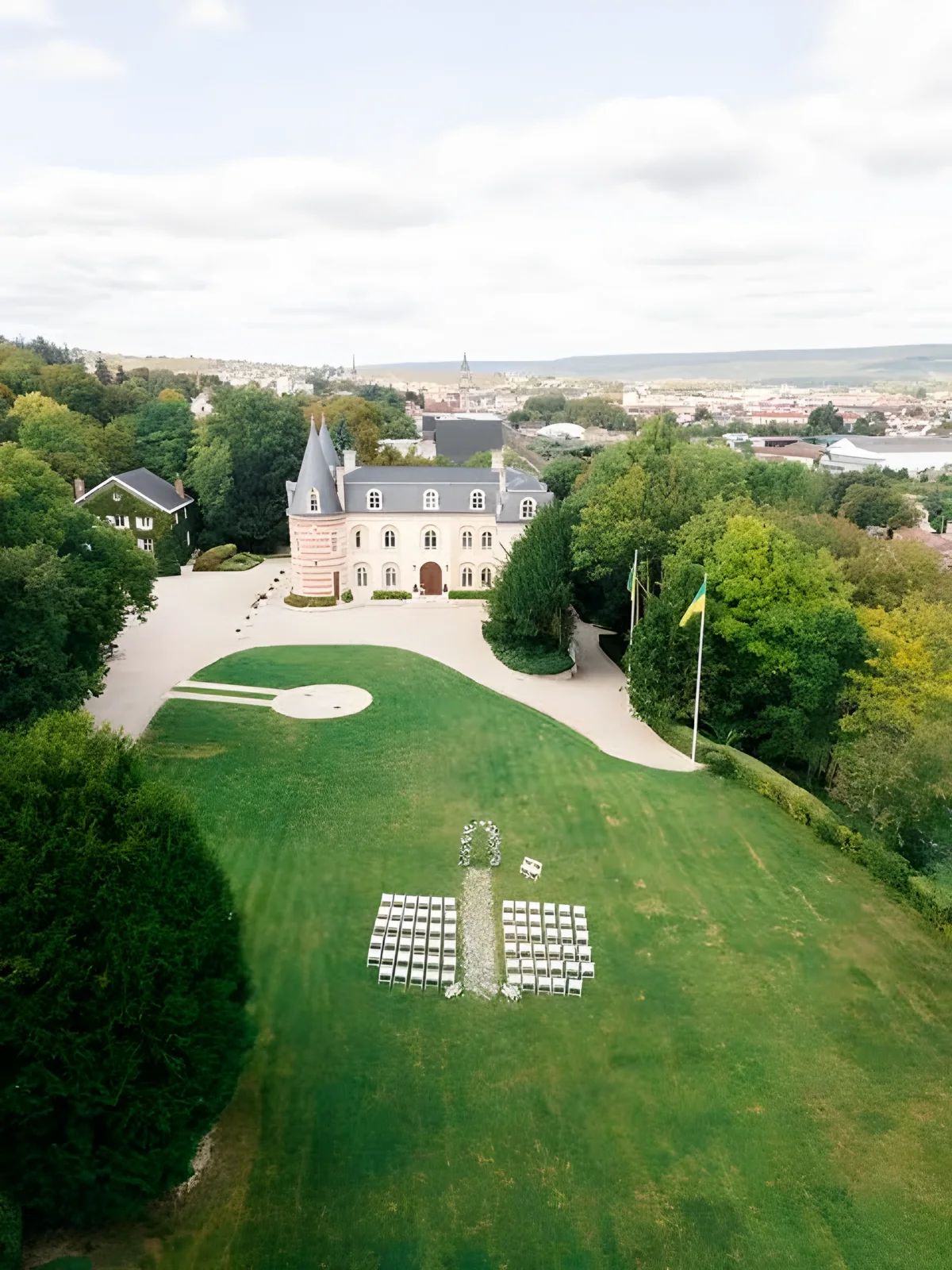 The park from above, chairs set out on the lawn in front of the château
